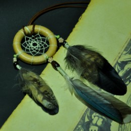 Фото Маленький ловец снов с перьями совы и дикой утки